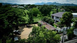 an aerial view of a house with a driveway at Inchantreedoopool in Kanchanaburi City