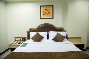 Hotel Tip Top Plaza客房内的一张或多张床位