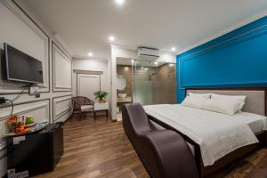 Giường trong phòng chung tại Hovi Hoang Cau 3 - My Hotel