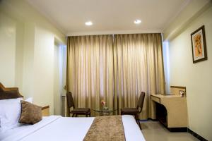 Hotel Tip Top Plaza客房内的一张或多张床位