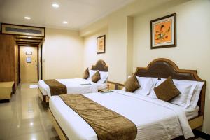 Hotel Tip Top Plaza客房内的一张或多张床位