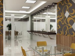 an office with a glass table and yellow chairs at Hotel Silver Leaf, Noida in Noida