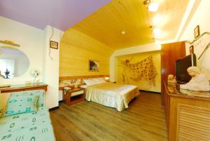 Katil atau katil-katil dalam bilik di Shinmingshan Holiday Inn