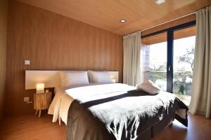 Ein Bett oder Betten in einem Zimmer der Unterkunft Horizonte Monte Verde