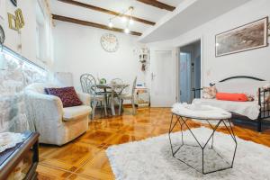 a living room with a couch and a table at Bingo Apartment in Split
