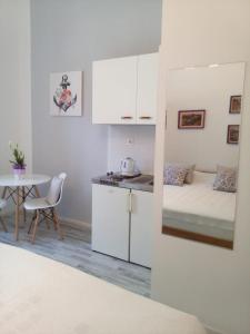a small apartment with a bed and a table at Studio in Pula center in Pula