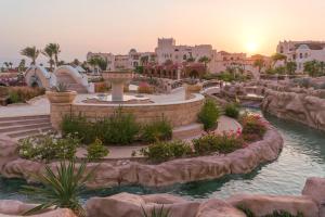 a resort with a water park with a fountain at Kempinski Hotel Soma Bay in Hurghada