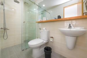 a bathroom with a toilet and a sink and a shower at MayMay Da Lat Apartments in Da Lat +48 photos
