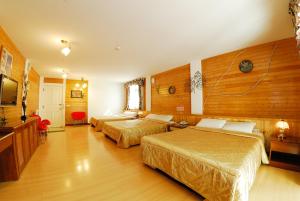 Katil atau katil-katil dalam bilik di Shinmingshan Holiday Inn