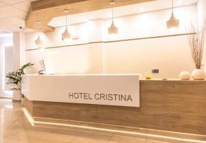 a hotel christiana reception desk in a lobby at Hotel Cristina in Los Alcázares