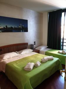 Postel nebo postele na pokoji v ubytování Caravaggio Apartments