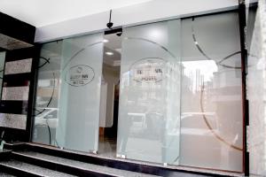 a store window with two signs that say send my ride at Sleep Inn Hotel - Kariakoo in Dar es Salaam +116 photos