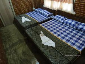 Postel nebo postele na pokoji v ubytování Belpeak Cottage