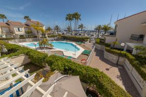 a view of a swimming pool at a resort at Pasito Blanco Holiday Home - Casa Yairan in Pasito Blanco