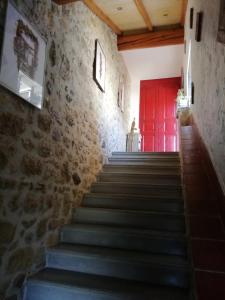 a stairway with a red door in a building at VILLA ARTEMiA in Sigean