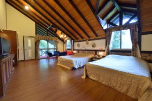 Katil atau katil-katil dalam bilik di Shinmingshan Holiday Inn