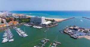 an aerial view of a marina with boats in the water at Beach Apartment Marina Vilamoura in Vilamoura