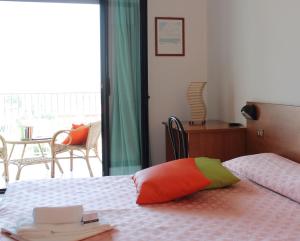 Postel nebo postele na pokoji v ubytování Hotel Villa Truentum