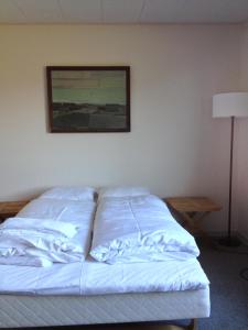 Postel nebo postele na pokoji v ubytování Hotel Vadehavet