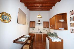 A kitchen or kitchenette at Serravalle Relais & Country Villa with private pool - Esclusive use