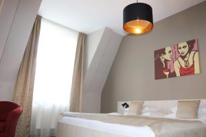 Postel nebo postele na pokoji v ubytování 1.Republic Hotel