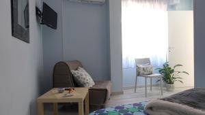 a living room with a couch and a table at Corte Risco in Ogliastro Cilento
