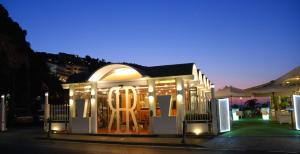 a small building with lights on it at night at Hotel Rivage in Sorrento