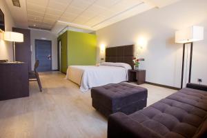 Postel nebo postele na pokoji v ubytování Hotel Torre de Núñez