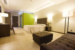Postel nebo postele na pokoji v ubytování Hotel Torre de Núñez