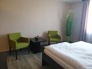 A bed or beds in a room at KMK Penzión Még 5 kép