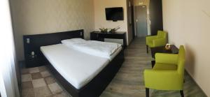 A bed or beds in a room at KMK Penzión