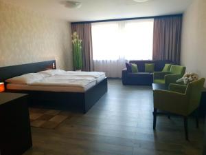 A bed or beds in a room at KMK Penzión