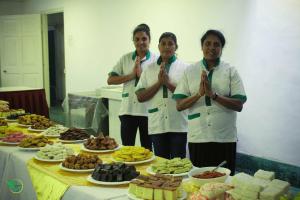four chefs standing in front of a table of food at Surrey Bird Sanctuary & Holiday Resort in Welimada