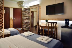 Posteľ alebo postele v izbe v ubytovaní Nikolas Rooms