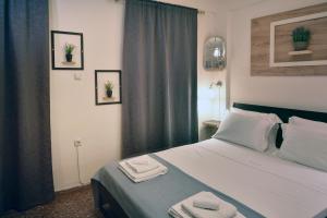 Posteľ alebo postele v izbe v ubytovaní Nikolas Rooms + 37 fotografií
