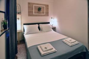 Posteľ alebo postele v izbe v ubytovaní Nikolas Rooms