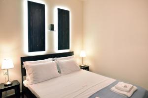 Posteľ alebo postele v izbe v ubytovaní Nikolas Rooms