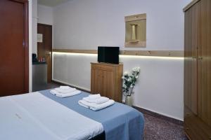 Posteľ alebo postele v izbe v ubytovaní Nikolas Rooms
