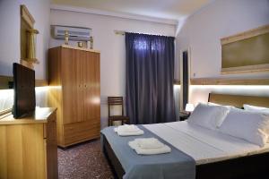 Posteľ alebo postele v izbe v ubytovaní Nikolas Rooms