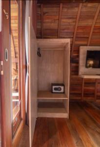 a small cabinet with a toaster in a room at Poedja Villa Jimbaran in Jimbaran