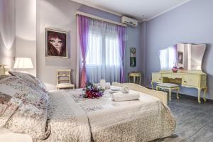 Postel nebo postele na pokoji v ubytování Villa Intemella + 37 fotografií