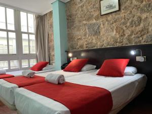 Cama o camas de una habitación en Hostal Hotil Coruña Centro