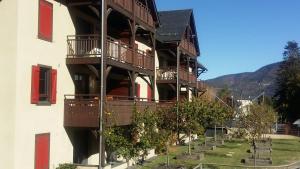 a building with balconies on the side of it at Le Petit Verger 104 in Saint-Lary-Soulan