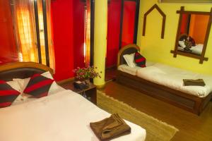 Cama o camas de una habitación en Siddhi Home & Restaurant