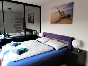 Posteľ alebo postele v izbe v ubytovaní Apartament Morski Integro
