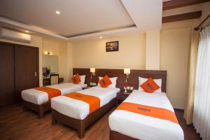 Krevet ili kreveti u jedinici u okviru objekta Hotel Jay Suites