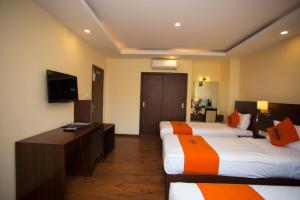 Krevet ili kreveti u jedinici u okviru objekta Hotel Jay Suites