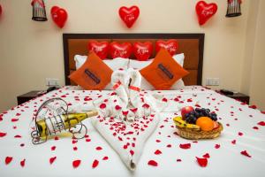 Krevet ili kreveti u jedinici u okviru objekta Hotel Jay Suites