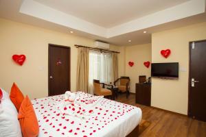Krevet ili kreveti u jedinici u okviru objekta Hotel Jay Suites