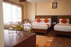 Krevet ili kreveti u jedinici u okviru objekta Hotel Jay Suites